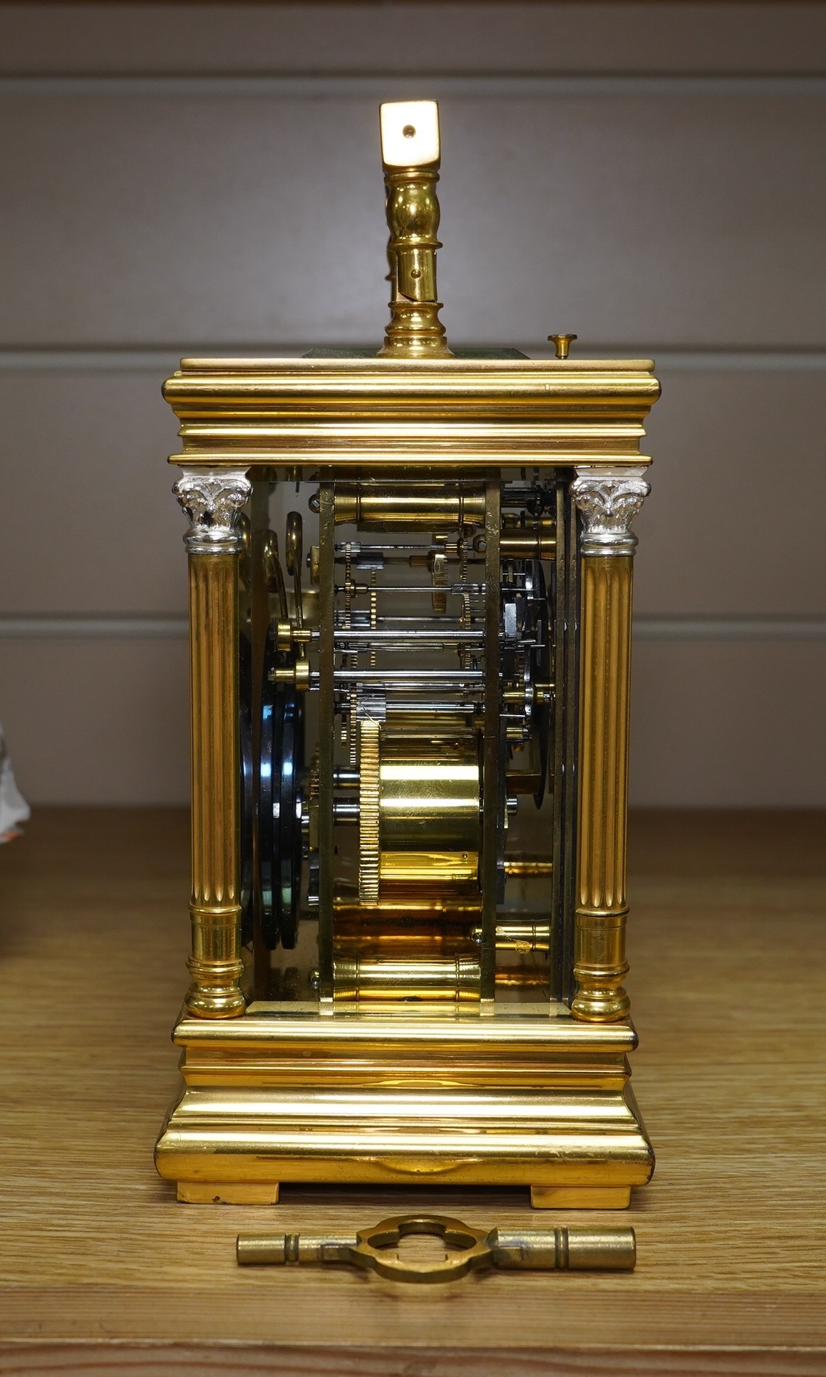 A French silvered and gilt brass hour repeating carriage clock with enamel dial, with key, 20cm high. Condition - good, untested